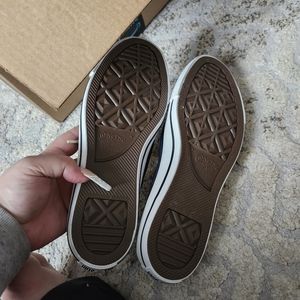 Dark blue shoreline converse